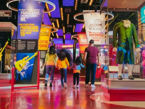 Family walking through National Museum of American History