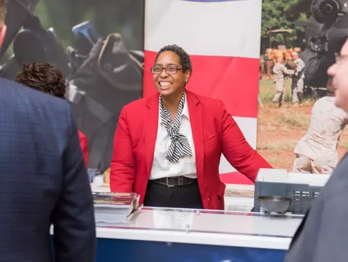 Destination DC Staffing Services redcoat assisting meeting attendee - Staffing solutions for events in Washington, DC